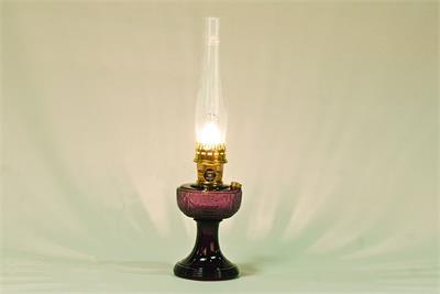 This Short Lincoln Drape Table Lamp comes with nickel-plated solid brass hardware with a durable laquered finish. Includes a fill cap for easy refilling. Holds 1 quart of kerosene. 24" overall height.