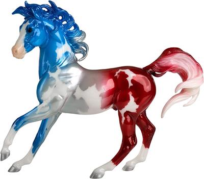 With his mane and tail blowing like a ­flag in the wind, Anthem is a richly hued decorator model that pays tribute to America’s national anthem, “The Star-Spangled Banner.” His pinto coat takes on the familiar hues of red, white, and blue.