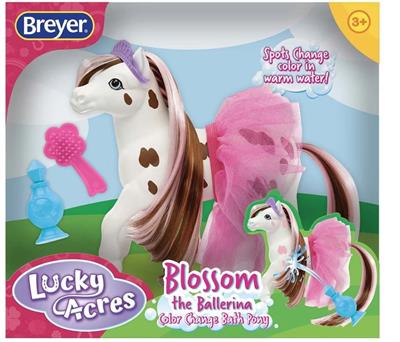 Breyer Horses Blossom the Ballerina Color Changing Appaloosa #7213 Includes: "perfume" squirt bottle, hairbrush, tutu and tiara.  When this friendly Appaloosa is done pirouetting and prancing, she hops in the bath. Surprise! Her brown markings turn pink i